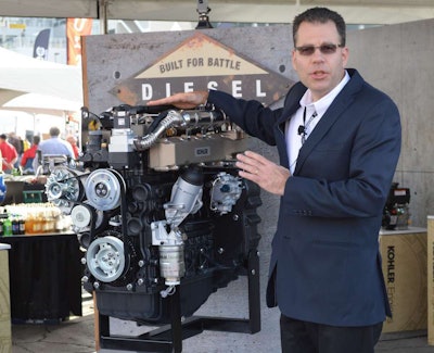 Jeff Wilke, product manager for diesel engines in North America, with the KDI 3404 at World of Concrete.
