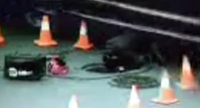 The moment before Roberts was run over by the truck’s rear tire, captured by surveillance video.