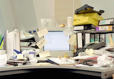 If your monitor looks like this one, you’re probably still using Windows 95 and if that’s the case you have much bigger problems than paper clutter.