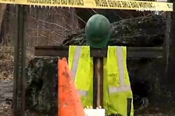 A still from a WFSB report shows a memorial co-workers set up for Araujo after he was shot.