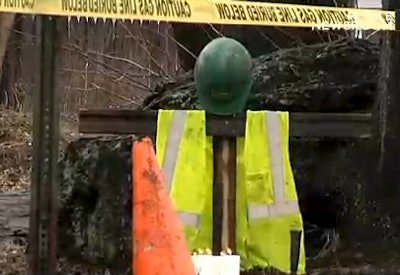 A still from a WFSB report shows a memorial co-workers set up for Araujo after he was shot.