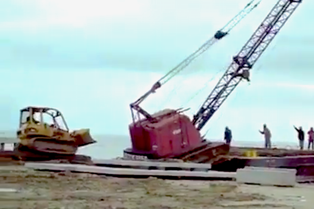 Dozer pushes crane
