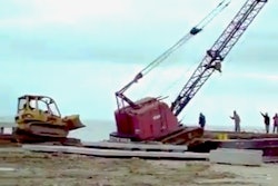 Dozer pushes crane