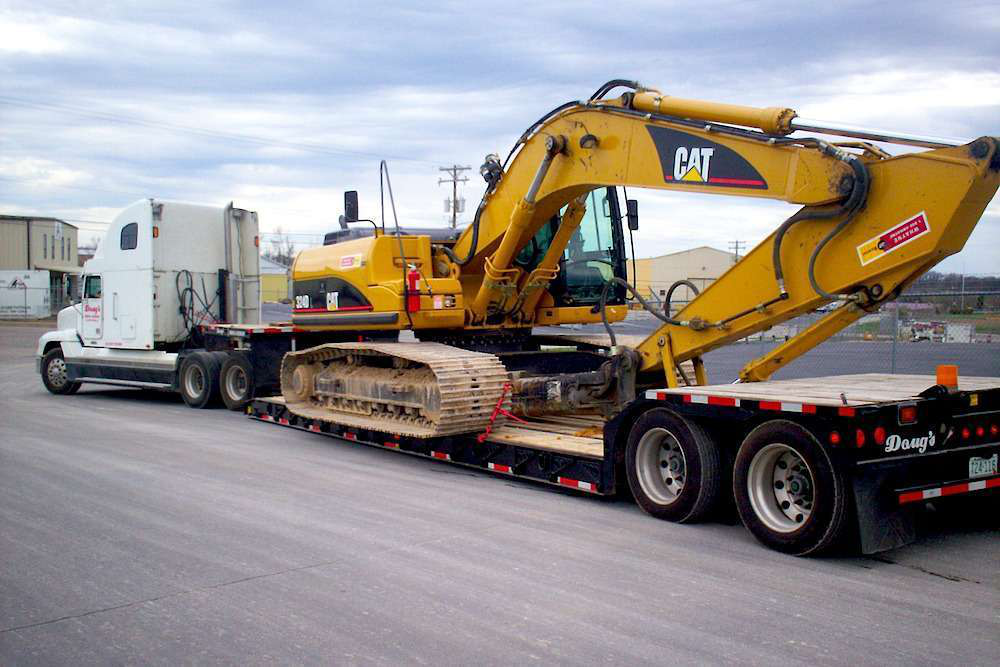 Heavy equipment hauling heavy haul construction equipment