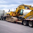 Heavy equipment hauling heavy haul construction equipment