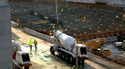 A still from the WITI report shows the concrete pour in progress.
