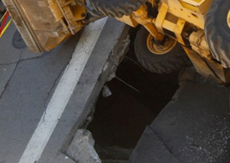 backhoe in hole