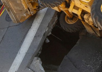 backhoe in hole