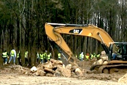 In this still from WHAS video, soil and rock is sifted and carefully monitored while volunteer workers search through the surrounding woods for clues to the skull’s origin.