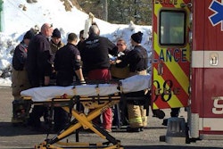 Paramedics secure a construction worker before transport after he fell 15 feet onto rebar. Credit: Rochester Fire Department