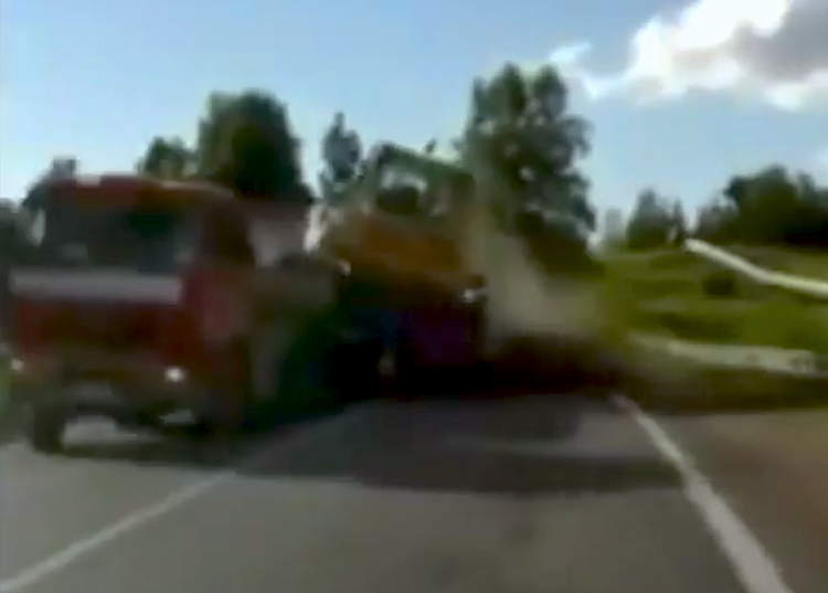 Bulldozer falls from trailer while being hauled