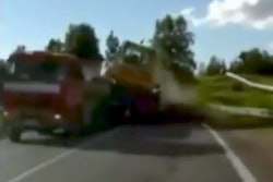 Bulldozer falls from trailer while being hauled