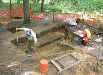 Archaeologists mapping a buried archaeological layer on the M-231 project.