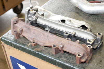 BD Full Bore manifold (top) is made from high-silicon ductile iron and is a direct bolt-in replacement for the factory manifold.