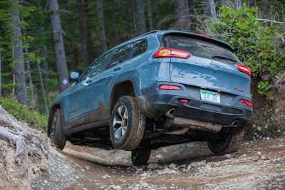 2015 Jeep Cherokee Trailhawk wheeling the extreme off-road test section during Mudfest 2015.