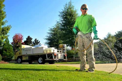 guy-spraying-lawn