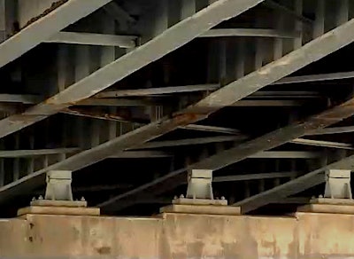 A still from WFSB news footage shows corrosion beneath a bridge in Hartford.