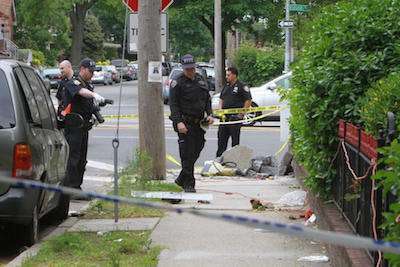 Police at the scene of the shooting. Credit: Jesse Ward/New York Daily News