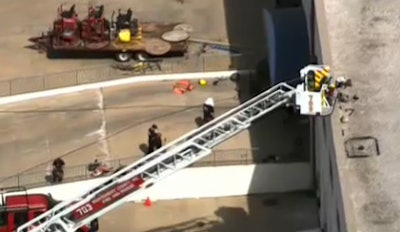 A still from WJLA footage shows the concrete finishers that were being used inside the warehouse.