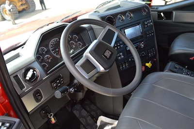 Automotive appointments and a standard leather-wrapped steering wheel give the cab an upscale feel.