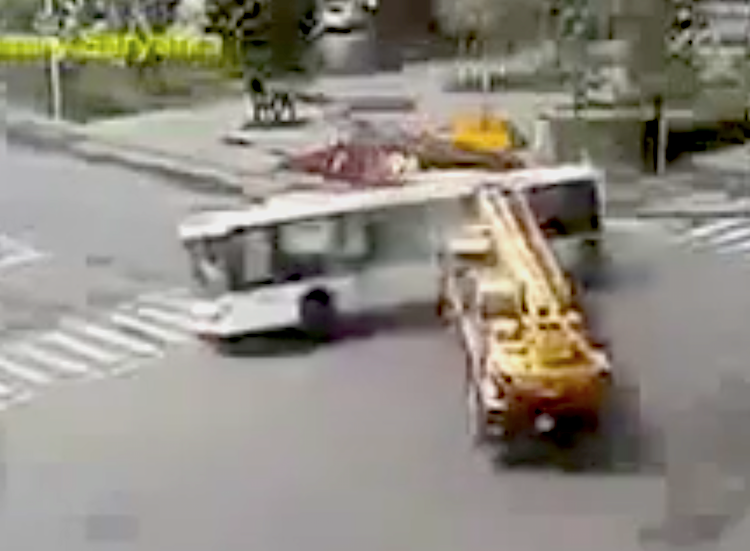 Crane hits bus