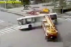 Crane hits bus