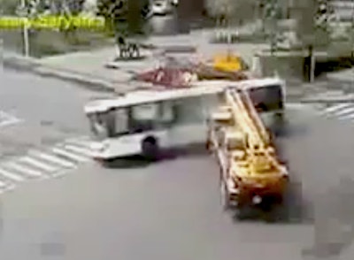 Crane hits bus