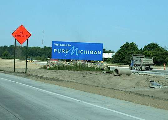 Michigan welcome sign with road work