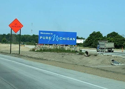 Michigan welcome sign with road work