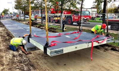 Crews install a SolaRoad bike path in the Netherlands in 2014.