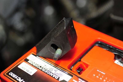 The only GM part needed for the installation is this special battery retainer. It costs less than $5 from the local GM dealer.