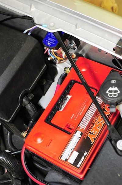 The finished auxiliary battery installation looks every bit OEM. It should as GM already had a second battery in this location for some applications.