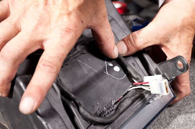 Press and mold it. Doesn;t look pretty--but no water is going to get inside the headlight.