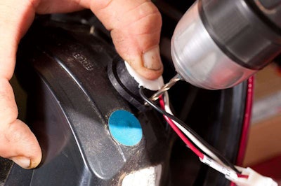 Use the strobe flange to drill a pilot hole into the plastic housing. This keeps housing from cracking.