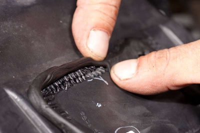 Run a bead of 3M butyl mastic tape (windshield sealer) around the welded seam to seal.