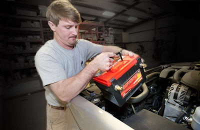 Lift and set the Odyssey battery into position. Don't wory about any acid spills--the absorbed glass mat (AGM) design is spill- and leak-proof.