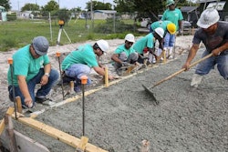 Atlantic High School students at work on a home in Delray Beach. Credit: Lannis Waters / The Palm Beach Post