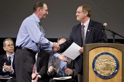 William Giltner receives his award from Steven Hatter, deputy commissioner of ADOT&PF. Photo credit: Michael Penn/Juneau Empire