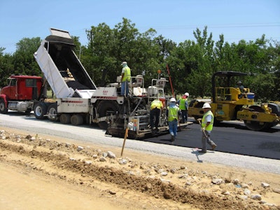 Placement of 1-inch warm-mix asphalt bond breaker prior to CRCP for an FHWA, Highways for LIFE project in Texas.