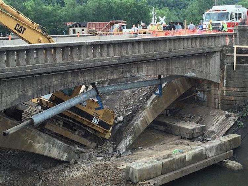 Bridge collapses beneath excavator, 2 workers, injuring one more on