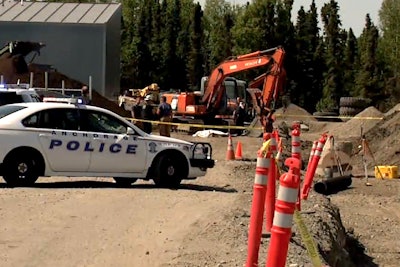 A still from KTVA footage shows police at the scene of the collapse.