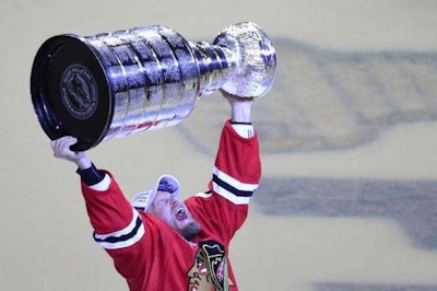 NHL veteran Kimmo Timonen celebrates his first Stanley Cup win Monday. After a 16-year career, Timonen had to wait a bit longer to celebrate the Chicago Blackhawks’ win over the Tampa Bay Lightning when the trophy got stuck in traffic.