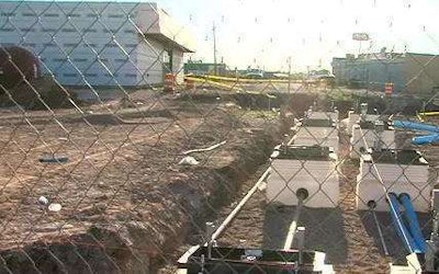 The scene of the trench collapse is seen in a still from KFDA TV footage.