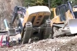 3 dozers pull excavator up hill