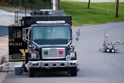 A bomb squad truck and robot arrive at the scene where the device was found. Photo Credit: Daniel Brenner/Columbia Daily Tribune