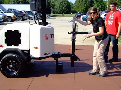 Marie Engstrom, associate product manager for Terex Aerial Work Platforms, demonstrating the RL4 towing tongue configuration.