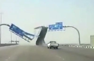 Dump truck bed destroys highway sign