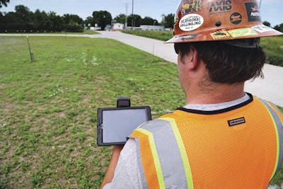 Shown here with a tablet mounted on a handheld receiver, Vermeer’s InSite Mapping tool gives you the ability to white line, or mark, the bore ahead of time.