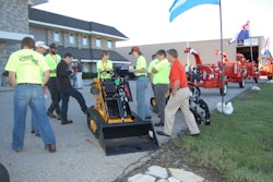 A Boxer brand compact mini skid steer. Boxer was acquired by Morbark in 2012.