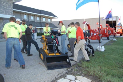 A Boxer brand compact mini skid steer. Boxer was acquired by Morbark in 2012.